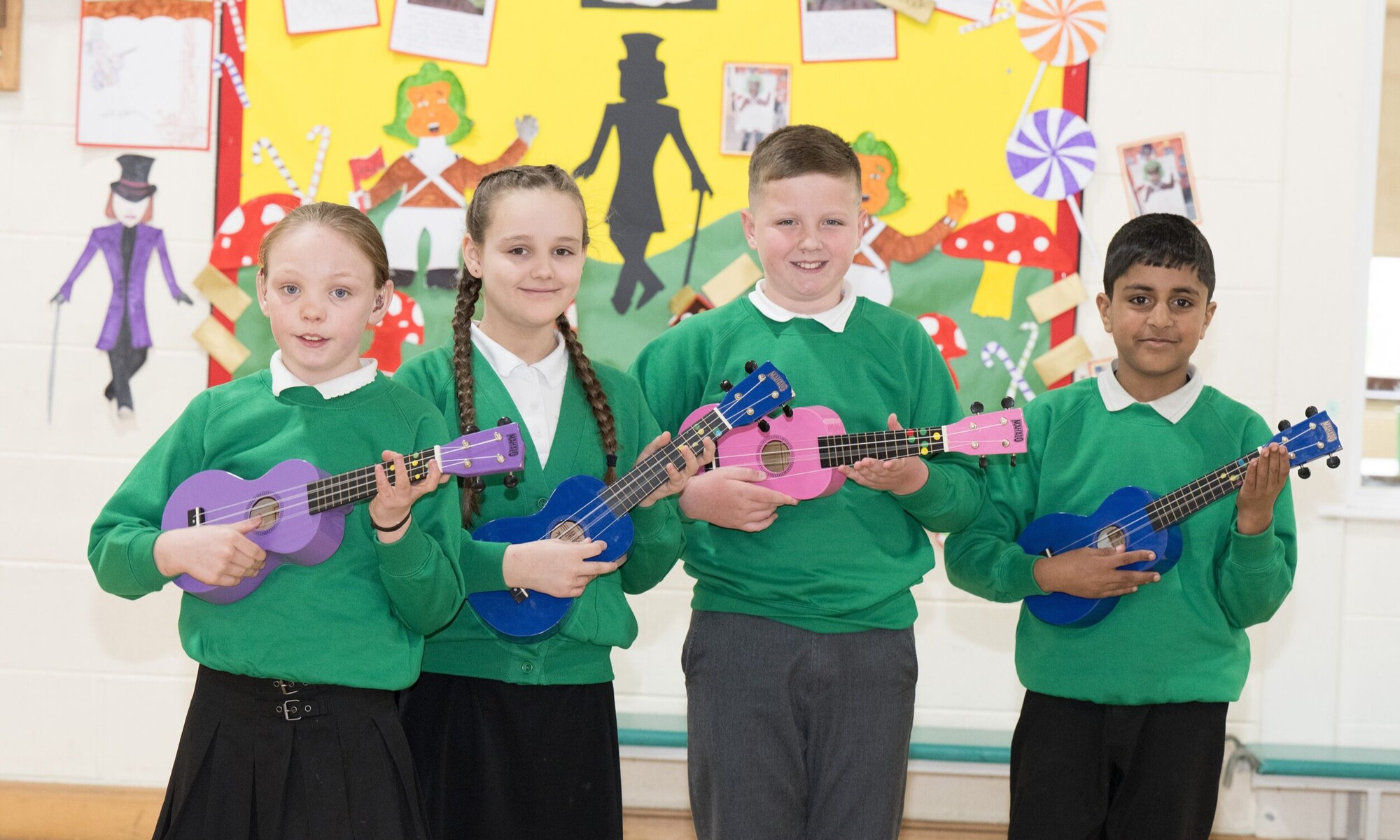 Pupils play ukeleles